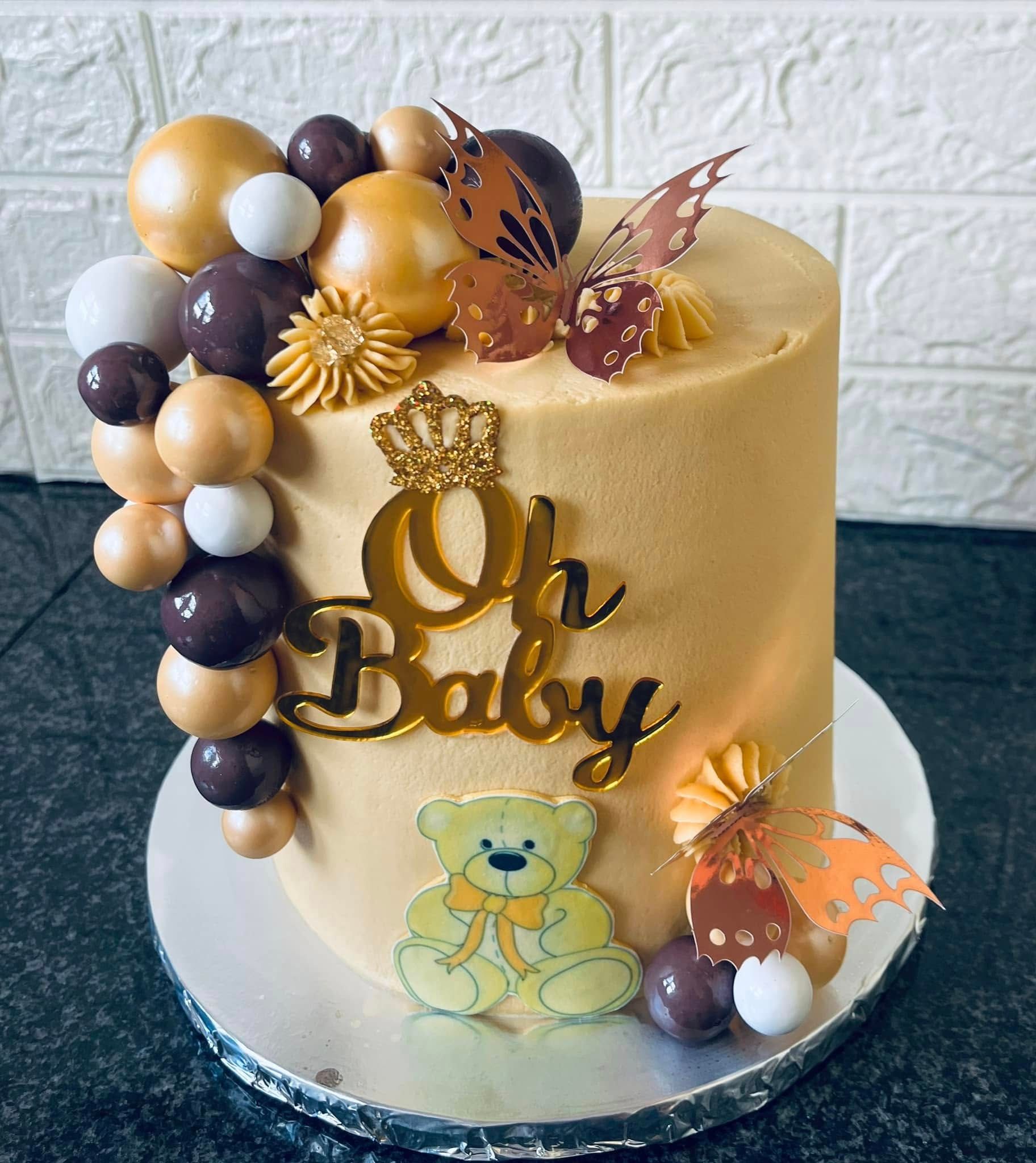 Oh Baby — Caramel, Cocoa & Crown — a custom bake by Fikiz Bakery